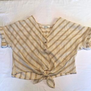 Yellow top, blue & white strips, ties at bottom.